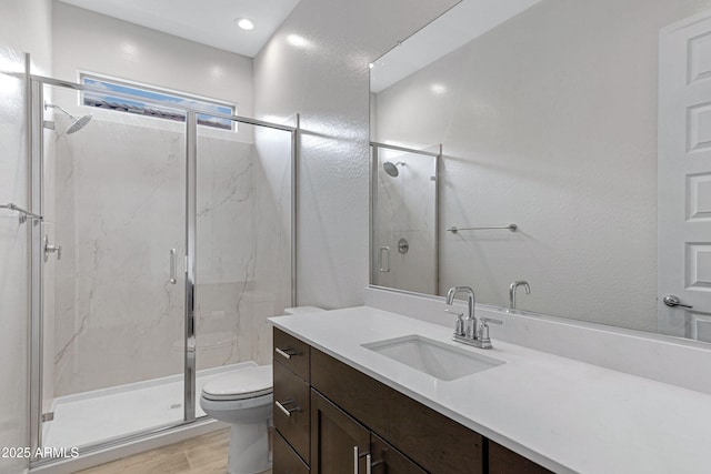 2968 E Tundra Ln, San Tan Valley, AZ 85143 - bathroom featuring a marble finish shower, toilet, vanity, and wood finished floors