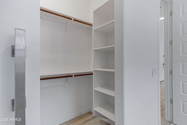 2968 E Tundra Ln, San Tan Valley, AZ 85143 - walk in closet with wood finished floors