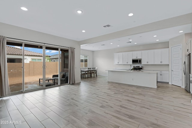 2968 E Tundra Ln, San Tan Valley, AZ 85143 - kitchen featuring visible vents, recessed lighting, white cabinetry, and stainless steel appliances