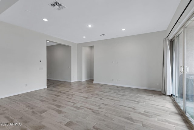 2968 E Tundra Ln, San Tan Valley, AZ 85143 - empty room featuring wood tiled floor, visible vents, recessed lighting, and baseboards