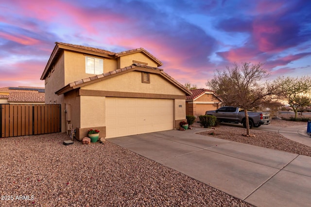 view of front of property with a garage