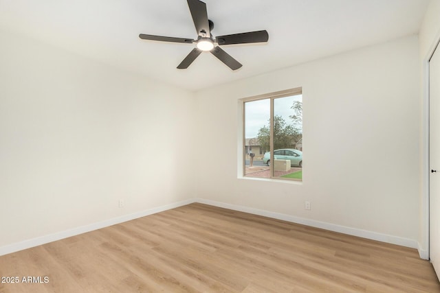 spare room featuring light hardwood / wood-style floors and ceiling fan