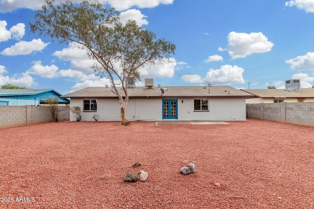 rear view of house featuring french doors and a patio area