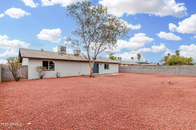 rear view of property featuring cooling unit and a patio