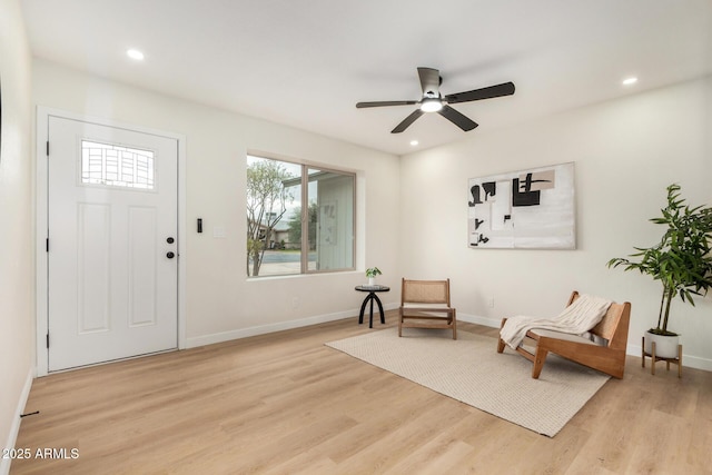 entrance foyer with ceiling fan and light hardwood / wood-style floors