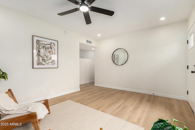 sitting room featuring ceiling fan and light hardwood / wood-style floors