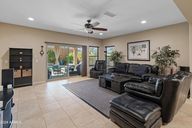 living room with ceiling fan and light tile patterned floors