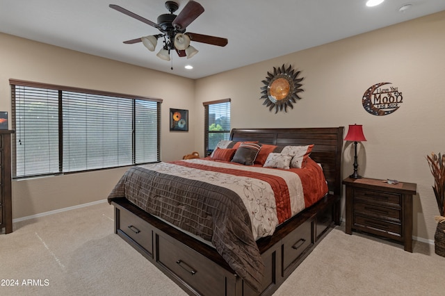 bedroom featuring ceiling fan and light colored carpet