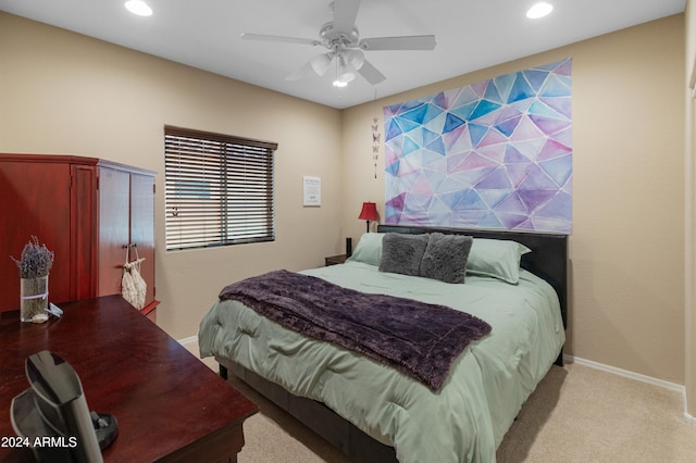 bedroom with light colored carpet and ceiling fan