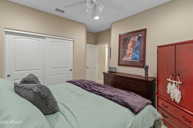 bedroom featuring ceiling fan and a closet