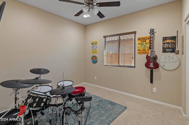 playroom with carpet and ceiling fan