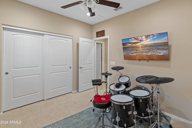 recreation room with carpet flooring and ceiling fan