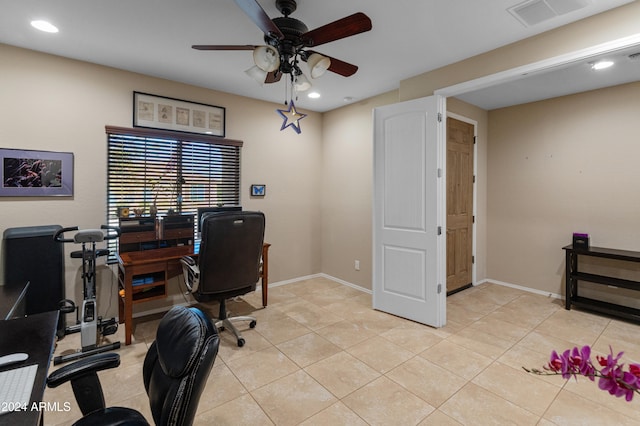 tiled home office featuring ceiling fan