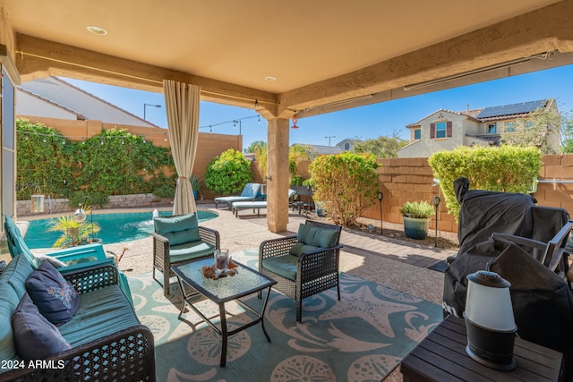 view of patio featuring a fenced in pool and pool water feature