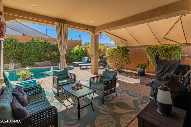 view of patio / terrace with pool water feature and a fenced in pool