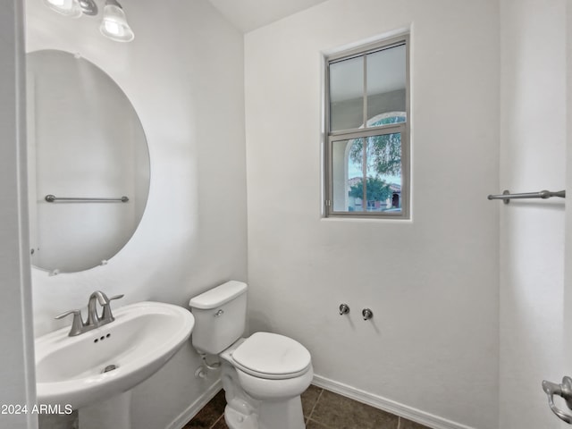 bathroom with tile patterned floors, toilet, and sink