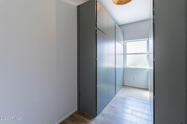 hallway with light wood-type flooring