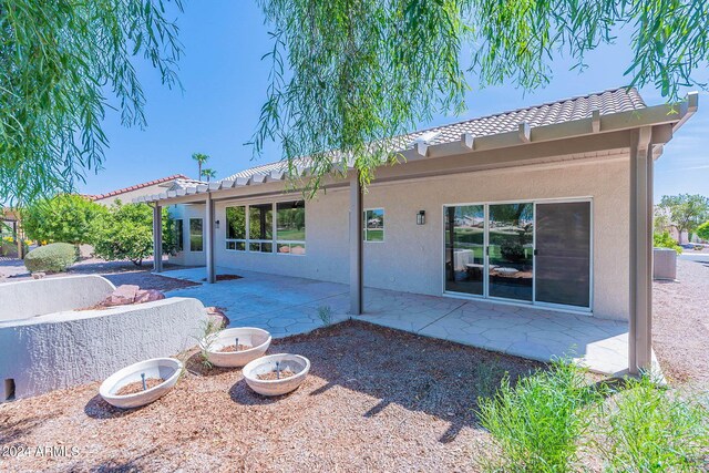 rear view of house with a patio