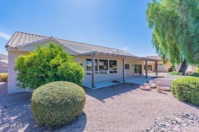 view of front of house with a patio area