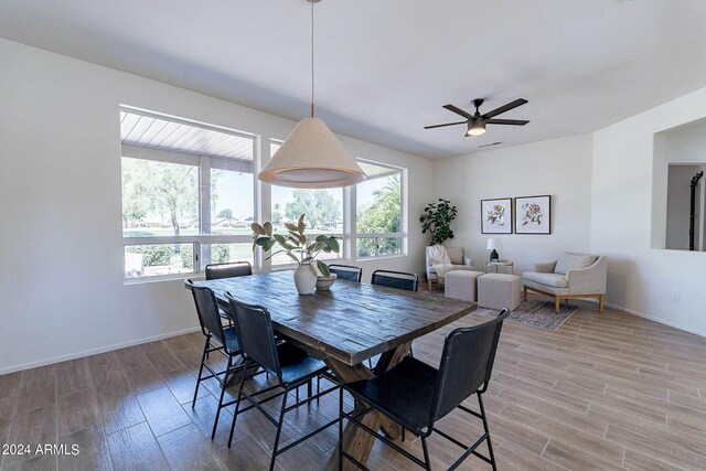 dining area featuring a wealth of natural light, light hardwood / wood-style floors, and ceiling fan