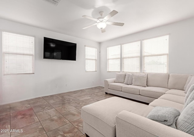 16789 W Moreland St, Goodyear, AZ 85338 - living area featuring baseboards and a ceiling fan