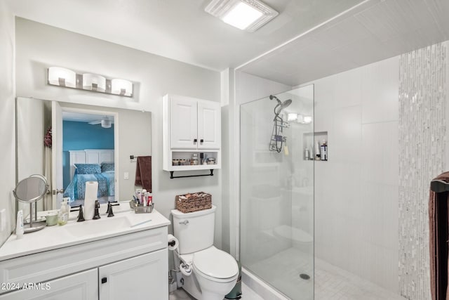 bathroom with vanity, toilet, and an enclosed shower