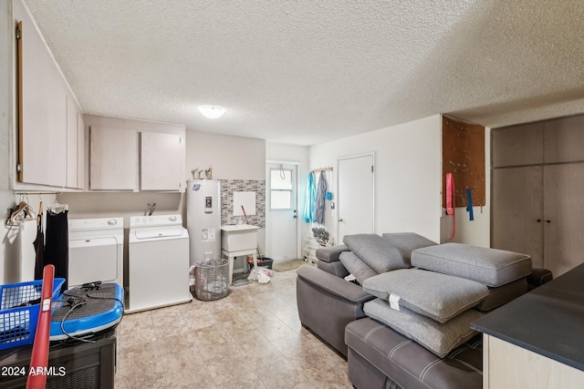 living room with a textured ceiling and separate washer and dryer