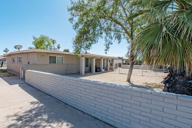 view of front of property featuring a patio