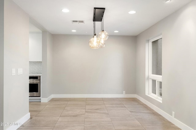 unfurnished dining area with light tile patterned floors