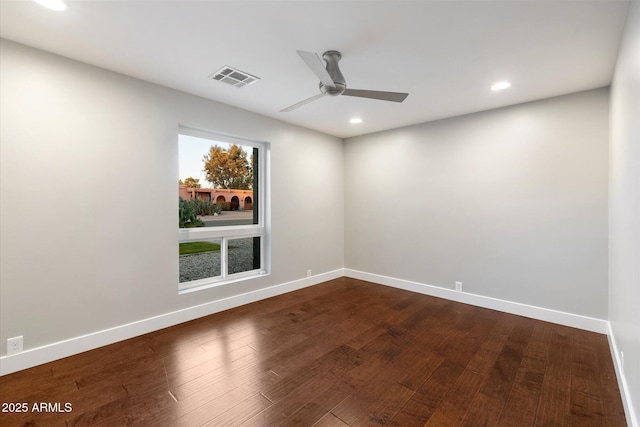 empty room featuring hardwood / wood-style flooring and ceiling fan