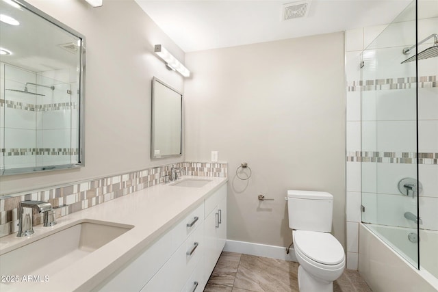 full bathroom featuring decorative backsplash, toilet, vanity, and shower / bath combination with glass door