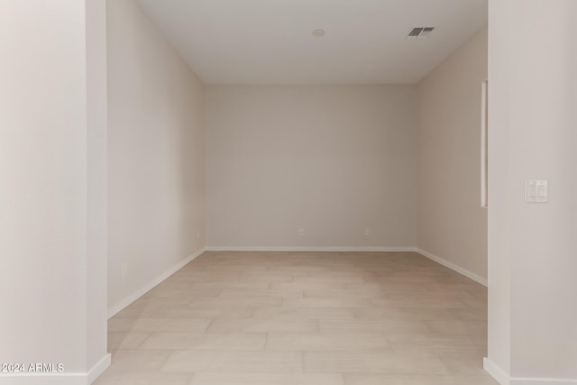 spare room with light hardwood / wood-style floors