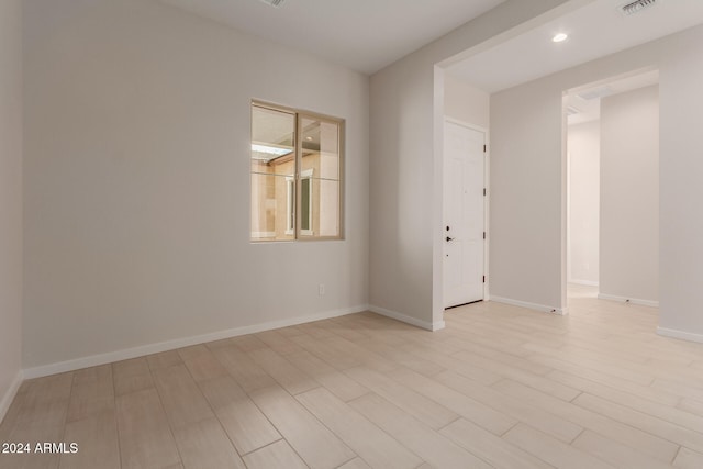 empty room with light wood-type flooring