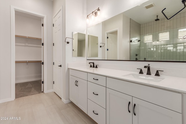 bathroom with vanity and an enclosed shower