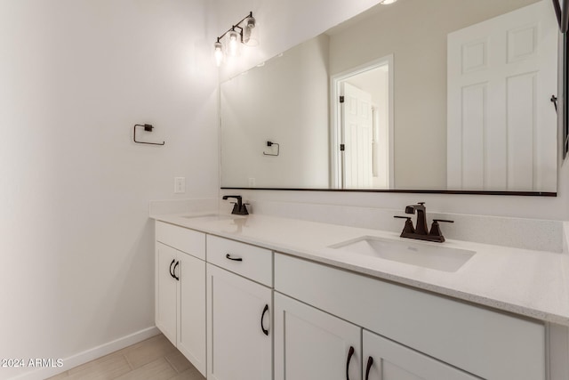 bathroom featuring tile patterned floors and vanity