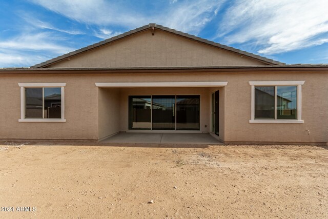 rear view of property featuring a patio area