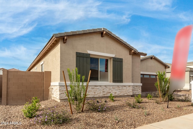 view of front of home with a garage