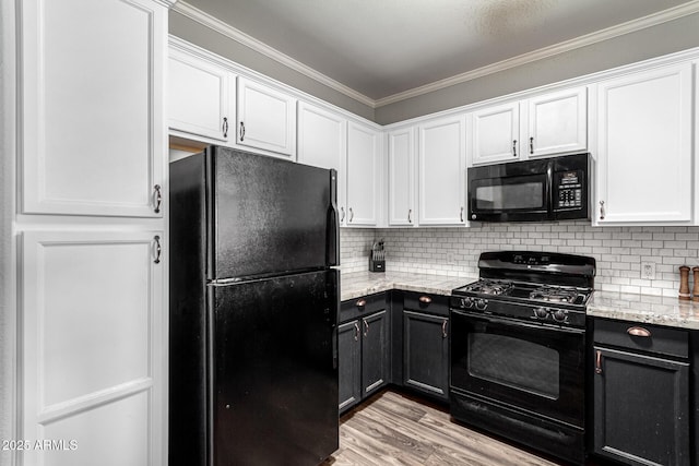 29606 N Tatum Blvd Unit 245, Cave Creek, AZ 85331 - kitchen with black appliances, white cabinetry, crown molding, and backsplash