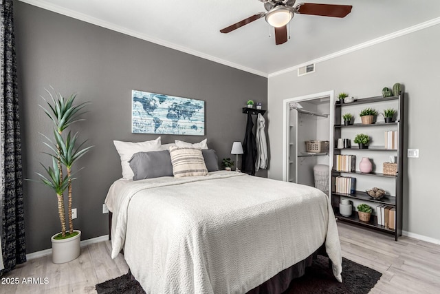 29606 N Tatum Blvd Unit 245, Cave Creek, AZ 85331 - bedroom featuring light wood finished floors, ornamental molding, baseboards, and a ceiling fan