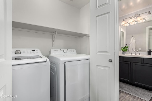 29606 N Tatum Blvd Unit 245, Cave Creek, AZ 85331 - laundry room featuring washing machine and clothes dryer and wood finished floors