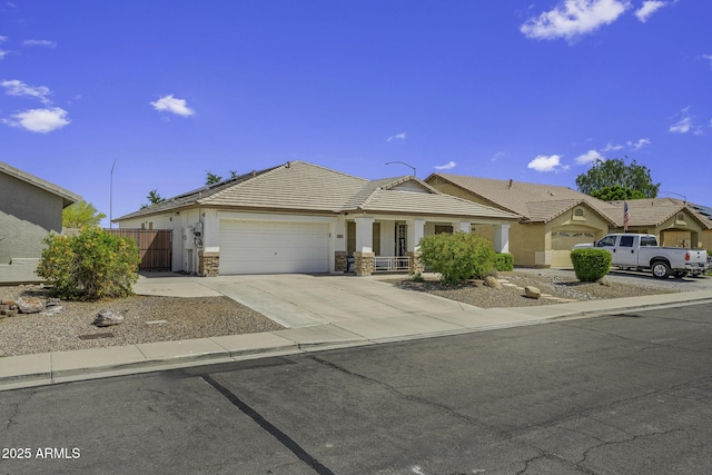 7832 E Osage Ave, Mesa, AZ 85212 - ranch-style home featuring a porch, stucco siding, driveway, a tiled roof, and an attached garage