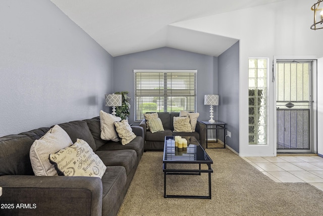 7832 E Osage Ave, Mesa, AZ 85212 - carpeted living area with tile patterned flooring, lofted ceiling, and baseboards