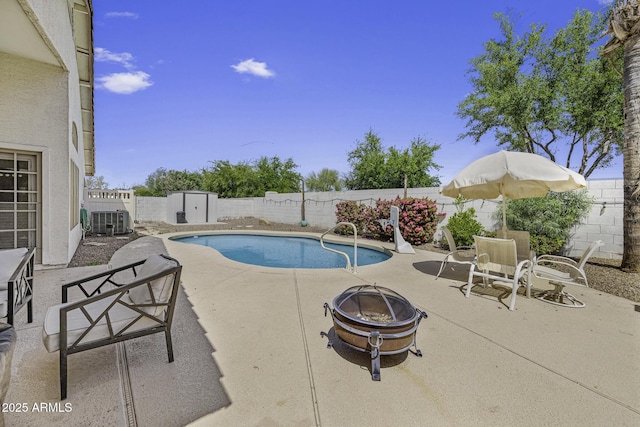7832 E Osage Ave, Mesa, AZ 85212 - view of swimming pool with a storage shed, a patio area, a fenced backyard, and an outdoor fire pit