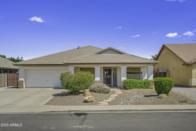 7832 E Osage Ave, Mesa, AZ 85212 - view of front of home featuring a tile roof, stucco siding, driveway, and an attached garage