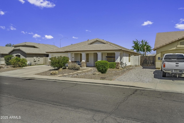 7832 E Osage Ave, Mesa, AZ 85212 - view of front facade featuring stucco siding, a gate, fence, a tile roof, and concrete driveway