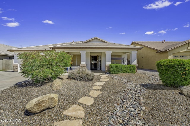 7832 E Osage Ave, Mesa, AZ 85212 - view of front of house featuring a porch, stucco siding, a tile roof, driveway, and an attached garage