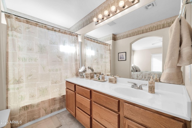 bathroom with vanity and tile patterned flooring