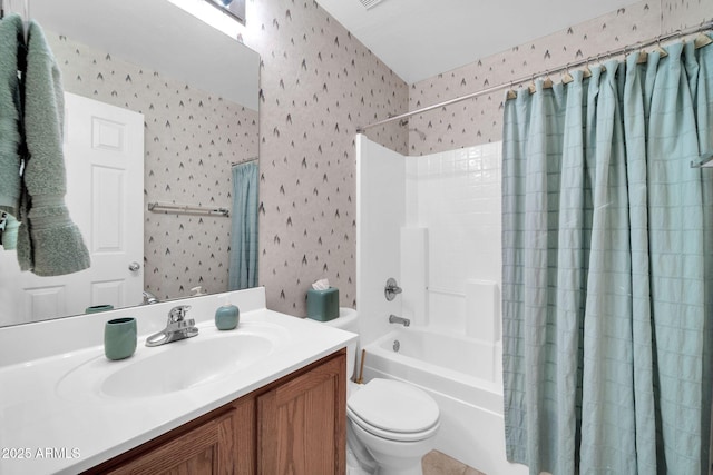 full bathroom featuring vanity, toilet, and shower / tub combo