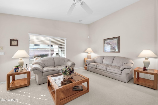 carpeted living room featuring ceiling fan