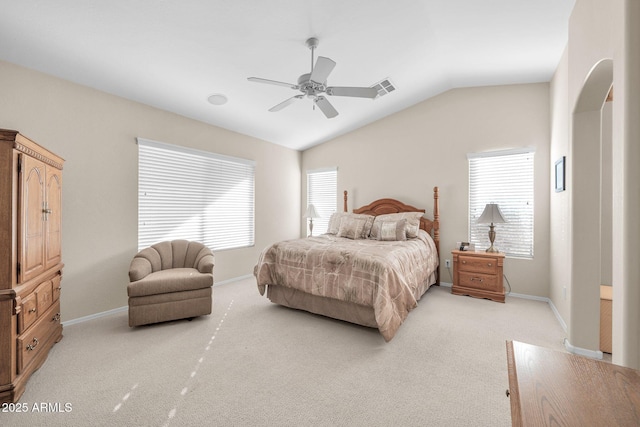 carpeted bedroom with ceiling fan and lofted ceiling